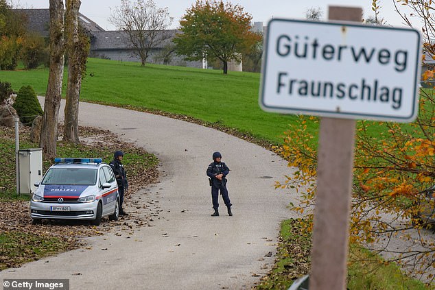 Law enforcement officers patrol during manhunt on October 28, 2024 near Rohrbach, Austria