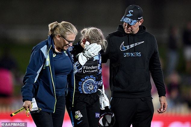 Wicketkeeper Bridget Patterson was assisted from the field (pictured) - with her coach Luke Williams later confirming she 'escaped serious injury.'