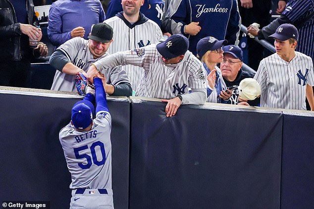 Both fans were banned from returning for Game 5 following the incident at Yankee Stadium