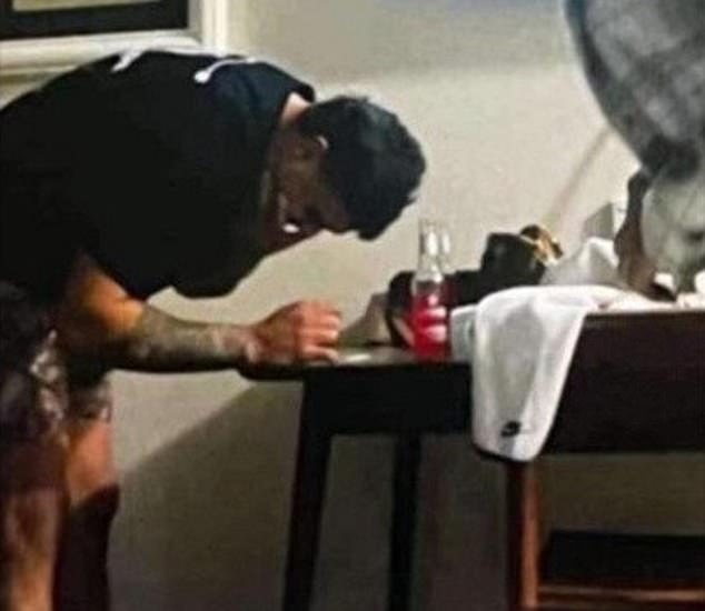 Mitchell was fined $20,000 by the NRL after the Integrity Unit investigated an image of him bending over a table with white powder on it in a Dubbo hotel room (pictured)