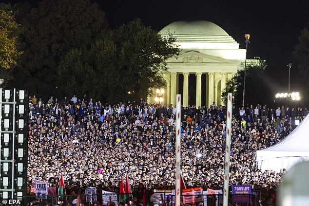 Supporters could be seen stretching back outside the security perimeter across the National Mall, with the Jefferson Monument seen in the background