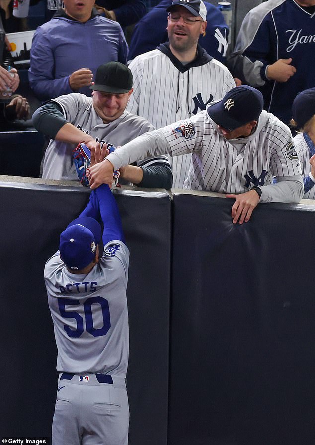 Austin Capobianco (left), a season ticket holder from Connecticut, was ejected for his antics