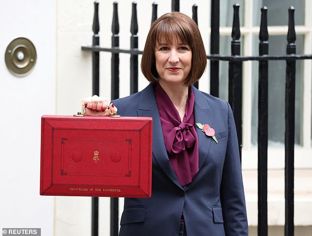 Ms Reeves carried out the traditional photo op outside the famous No11 black door today