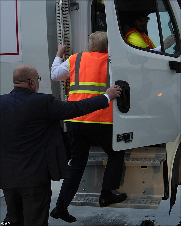 The side of the truck was emblazoned with a Trump sign and had an American flag on the window