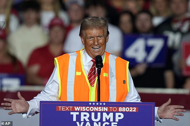 The ex-president donned the vest on stage at his rally in Green Bay too