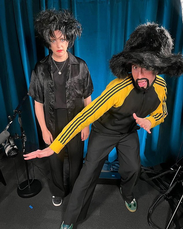 Annie Mac And Nick Grimshaw dressed s Robert Smith and Jay Kay of Jamiroquai