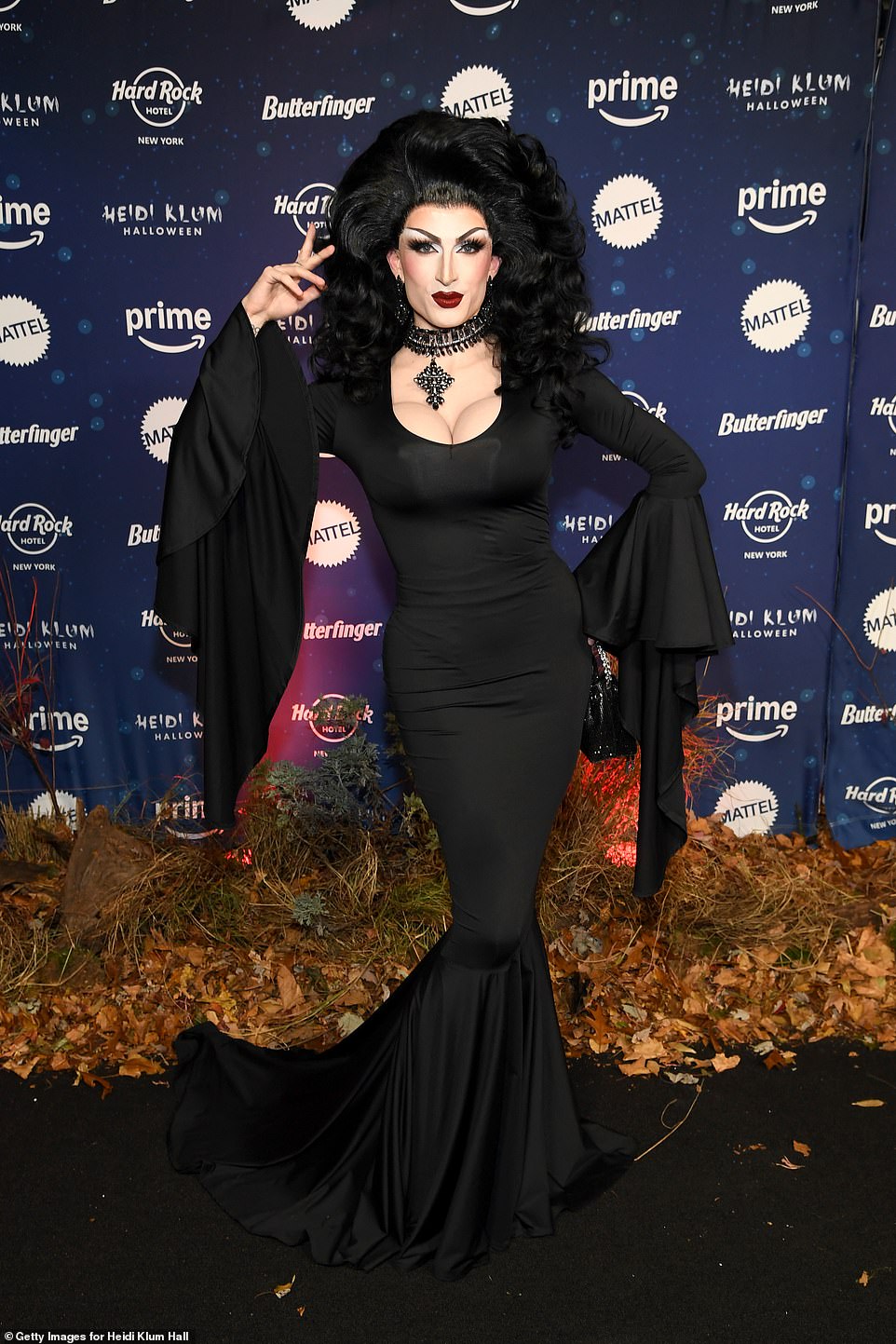 Aria Addams put on a glamorous display as Morticia from The Addams Family in a skintight dress with flowing sleeves