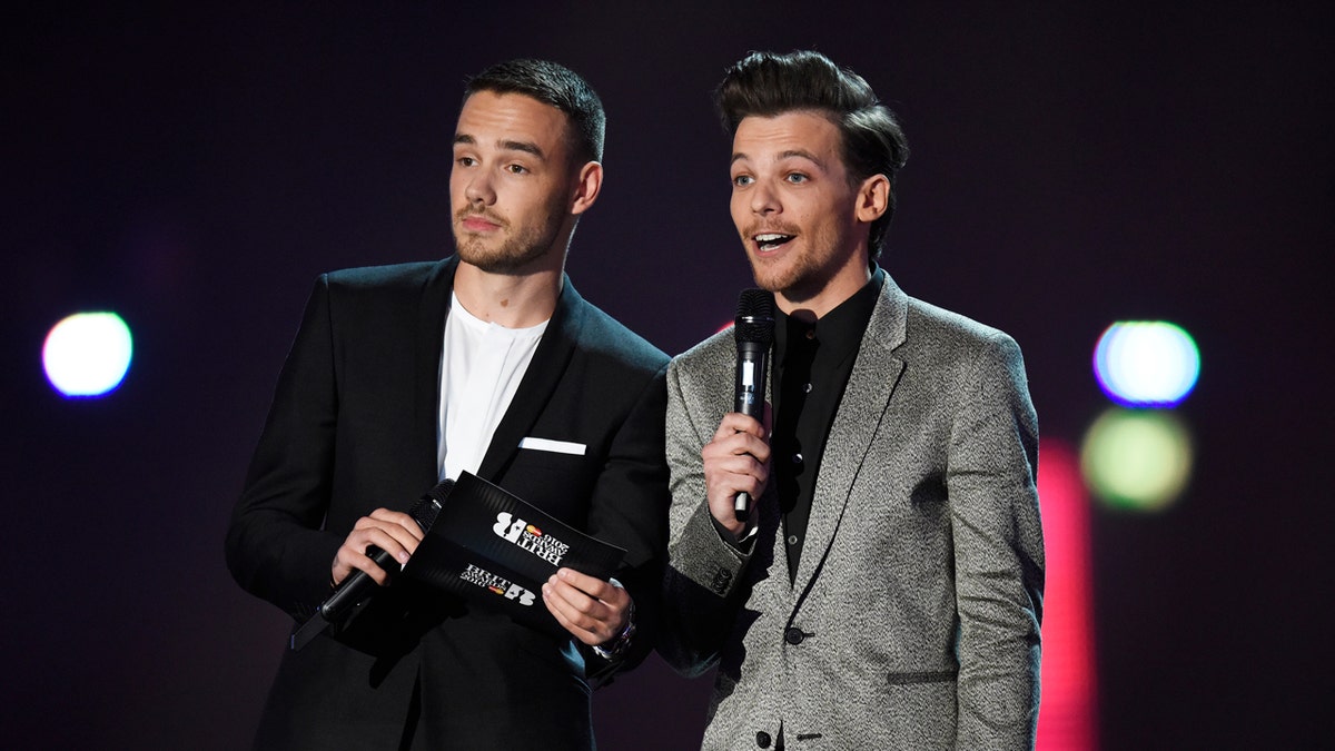 Liam Payne and Louis Tomlinson on stage