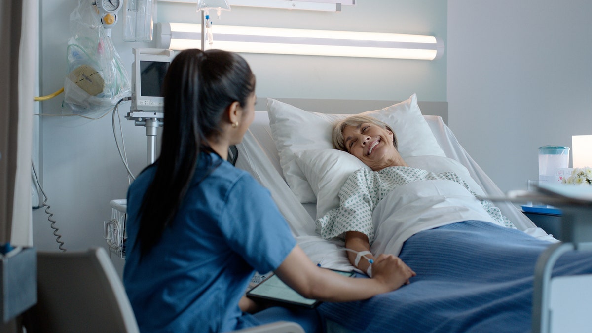 Nurse talks with patient