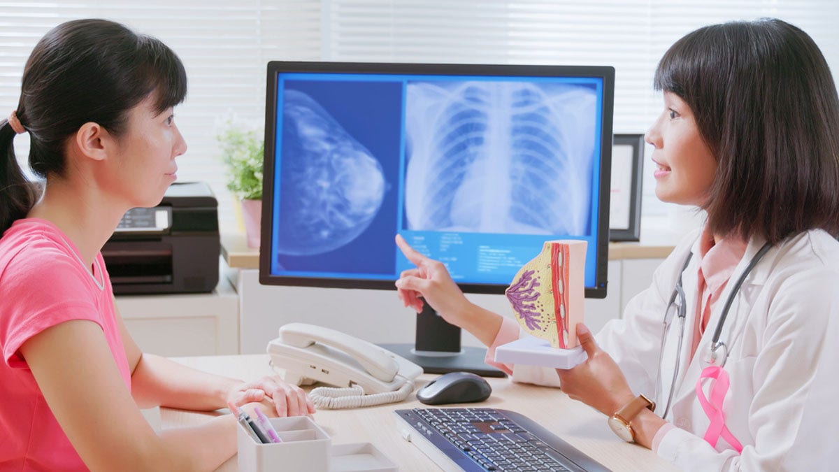 Woman talking to doctor