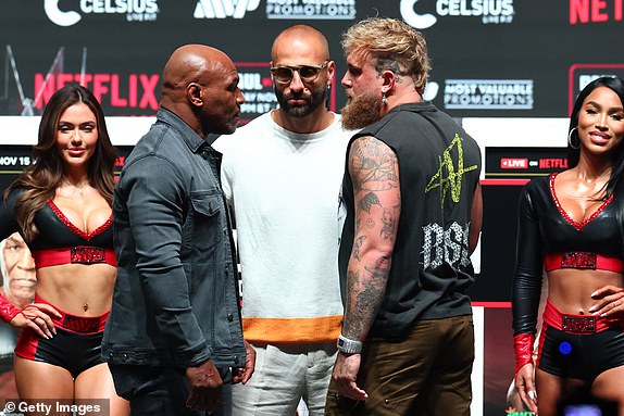 IRVING, TEXAS - NOVEMBER 13: Mike Tyson pose and Jake Paul pose after the final press conference for their upcoming heavyweight fight at Toyota Music Factory on November 13, 2024 in Irving, Texas. (Photo by Ed Mulholland/Getty Images)