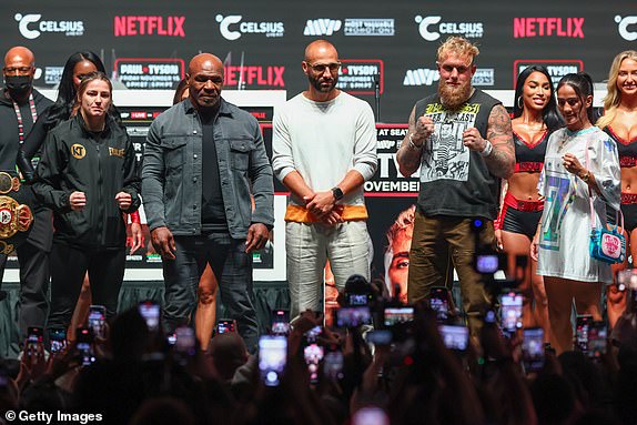 IRVING, TEXAS - NOVEMBER 13: Jake Paul and Mike Tyson pose after the final press conference for their upcoming heavyweight fight at Toyota Music Factory on November 13, 2024 in Irving, Texas. (Photo by Ed Mulholland/Getty Images)