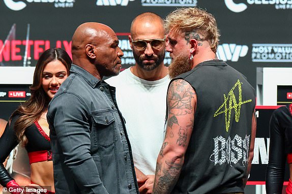 IRVING, TEXAS - NOVEMBER 13: Jake Paul and Mike Tyson pose after the final press conference for their upcoming heavyweight fight at Toyota Music Factory on November 13, 2024 in Irving, Texas. (Photo by Ed Mulholland/Getty Images)