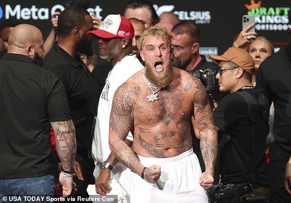 Nov 14, 2024; Irving, TX, USA;  Jake Paul reacts after being slapped by Mike Tyson (not pictured) after the weigh-in at the Toyota Music Factory.  Mandatory Credit: Kevin Jairaj-Imagn Images