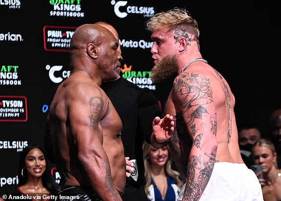 IRVING, TEXAS - NOVEMBER 14: Mike Tyson and Jake Paul faceoff during Weigh-In at the Toyota Music Factory in Irving, Texas on November 14, 2024 ahead of their match for heavyweight world titles of the Premiere Boxing Championship which will be on November 15 Friday night at AT&T Stadium in Arlington, Texas, United States. (Photo by Tayfun Coskun/Anadolu via Getty Images)