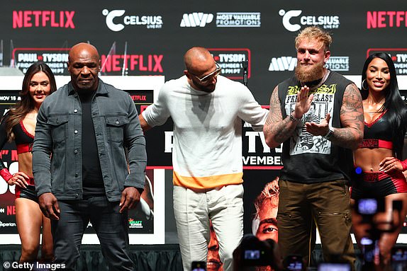 IRVING, TEXAS - NOVEMBER 13: Jake Paul and Mike Tyson pose after the final press conference for their upcoming heavyweight fight at Toyota Music Factory on November 13, 2024 in Irving, Texas. (Photo by Ed Mulholland/Getty Images)