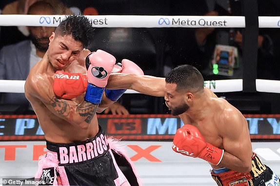 ARLINGTON, TEXAS - NOVEMBER 15: Abel Ramos (R) punches Mario Barrios during their WBC welterweight title bout at AT&T Stadium on November 15, 2024 in Arlington, Texas. (Photo by Christian Petersen/Getty Images)