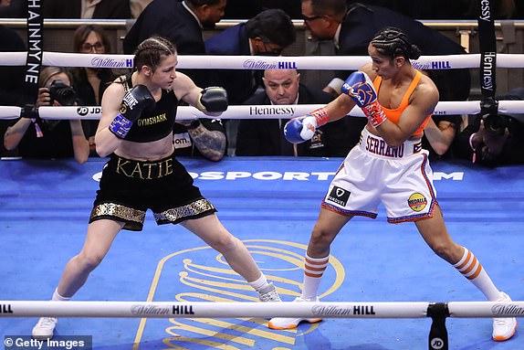 NEW YORK, NEW YORK - APRIL 30: Katie Taylor of Ireland (black trunks) and Amanda Serrano of Puerto Rico (white trunks) square off during their world lightweight championship fight. Taylor would win by split decision to remain the undisputed lightweight champion of the world and retain her WBA, WBC, IBF, WBO, and The Ring lightweight titles at Madison Square Garden on April 30, 2022 in New York, New York. Taylor and Serrano made history as the first female fighters to headline a boxing event in the venue's 140-year history. (Photo by J. Yim/Getty Images)