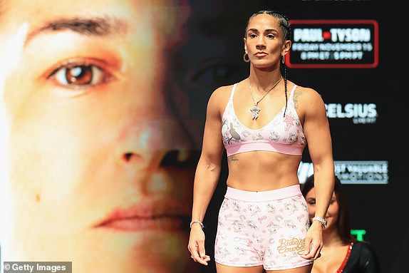 IRVING, TEXAS - NOVEMBER 14: Amanda Serrano poses on the scale during her ceremonial weigh-in at The Pavilion at Toyota Music Factory on November 14, 2024 in Irving, Texas. Serrano is scheduled to challenge undisputed super lightweight champion Katie Taylor for her title on November 15 at AT&T Stadium in Arlington, Texas. (Photo by Christian Petersen/Getty Images)