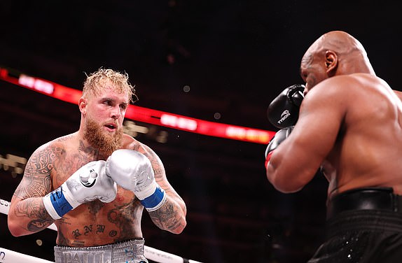 ARLINGTON, TEXAS - NOVEMBER 15: (L-R) Jake Paul and Mike Tyson fight during LIVE On Netflix: Jake Paul vs. Mike Tyson at AT&T Stadium on November 15, 2024 in Arlington, Texas. (Photo by Al Bello/Getty Images for Netflix Â© 2024)