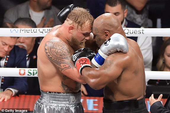 ARLINGTON, TEXAS - NOVEMBER 15: Jake Paul and Mike Tyson hug after their heavyweight bout at AT&T Stadium on November 15, 2024 in Arlington, Texas. (Photo by Christian Petersen/Getty Images)