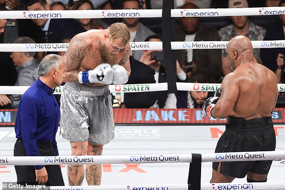 ARLINGTON, TEXAS - NOVEMBER 15: Jake Paul bows to Mike Tyson during their heavyweight bout at AT&T Stadium on November 15, 2024 in Arlington, Texas. (Photo by Christian Petersen/Getty Images)