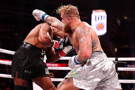 ARLINGTON, TEXAS - NOVEMBER 15: (L-R) Mike Tyson and Jake Paul fight during LIVE On Netflix: Jake Paul vs. Mike Tyson at AT&T Stadium on November 15, 2024 in Arlington, Texas. (Photo by Al Bello/Getty Images for Netflix Â© 2024)