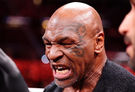 ARLINGTON, TEXAS - NOVEMBER 15: Mike Tyson fights during LIVE On Netflix: Jake Paul vs. Mike Tyson at AT&T Stadium on November 15, 2024 in Arlington, Texas. (Photo by Al Bello/Getty Images for Netflix Â© 2024)