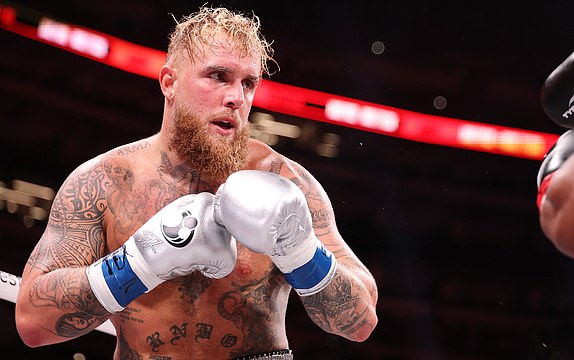 ARLINGTON, TEXAS - NOVEMBER 15: (L-R) Jake Paul and Mike Tyson fight during LIVE On Netflix: Jake Paul vs. Mike Tyson at AT&T Stadium on November 15, 2024 in Arlington, Texas. (Photo by Al Bello/Getty Images for Netflix Â© 2024)