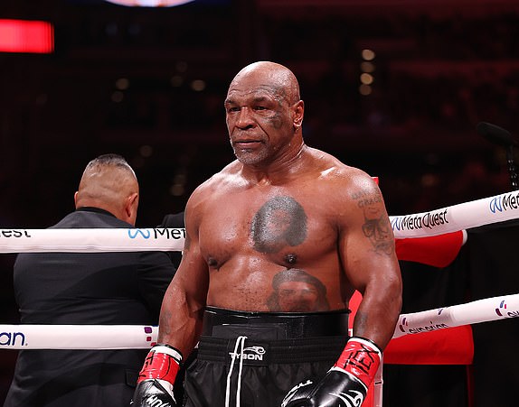 ARLINGTON, TEXAS - NOVEMBER 15: Mike Tyson fights during LIVE On Netflix: Jake Paul vs. Mike Tyson at AT&T Stadium on November 15, 2024 in Arlington, Texas. (Photo by Al Bello/Getty Images for Netflix Â© 2024)