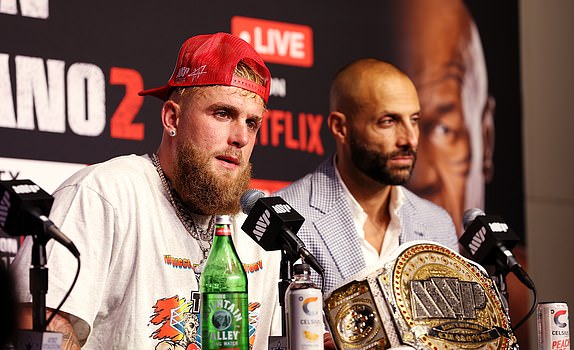 ARLINGTON, TEXAS - NOVEMBER 15: (L-R) Jake Paul and Michael Rubin speak during the post match press conference for LIVE On Netflix: Jake Paul vs. Mike Tyson at AT&T Stadium on November 15, 2024 in Arlington, Texas. (Photo by Sarah Stier/Getty Images for Netflix Â© 2024)