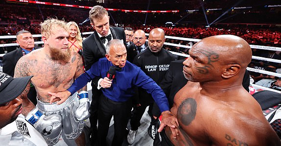 ARLINGTON, TEXAS - NOVEMBER 15: (L-R) Jake Paul and Mike Tyson fight during LIVE On Netflix: Jake Paul vs. Mike Tyson at AT&T Stadium on November 15, 2024 in Arlington, Texas. (Photo by Al Bello/Getty Images for Netflix Â© 2024)