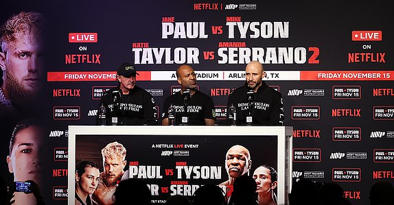 ARLINGTON, TEXAS - NOVEMBER 15: Mike Tyson's coaches Billy White (L) and Rafael Cordeiro (C) speak during the post match press conference for LIVE On Netflix: Jake Paul vs. Mike Tyson at AT&T Stadium on November 15, 2024 in Arlington, Texas. (Photo by Al Bello/Getty Images for Netflix Â© 2024)