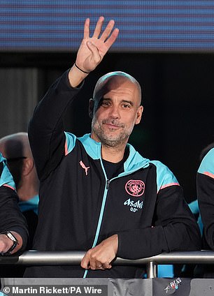 Pep Guardiola holds up four fingers to show fans just how successful they've been