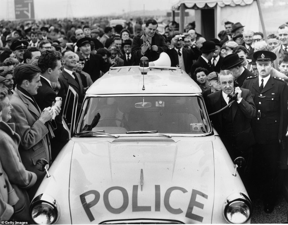 This image from the day of the M1's inauguration shows Marples using a police radio telephone to order County Police to open up the M1 motorway to traffic