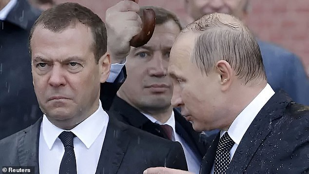 Former Russian president Dmitry Medvedev, now a senior Kremlin security official, pictured with Vladimir Putin