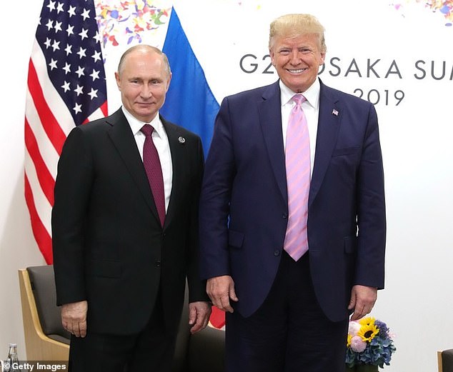 FILE IMAGE: US President Donald Trump (R) meets Russian President Vladimir Putin (L) on the first day of the G20 summit in Osaka, Japan on June 28, 2019