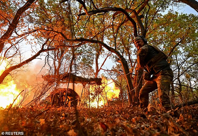 A Ukrainian service member from the special police unit Hyzhak (Predator) fires a howitzer D30 towards Russian troops, amid Russia's attack on Ukraine, near the frontline city of Toretsk, Ukraine October 25, 2024