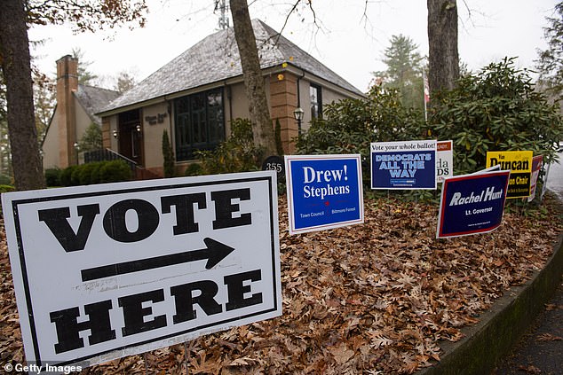 Voting signs direct people to Biltmore Forest Town Hall on November 5, 2024 in Asheville, North Carolina