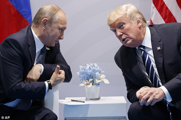 FILE - President Donald Trump meets with Russian President Vladimir Putin at the G-20 Summit in Hamburg, July 7, 2017