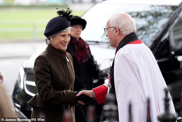 The royal was snapped greeting the Dean of Westminster, the Very Reverend Dr David Hoyle, during her visit to the Field of Remembrance