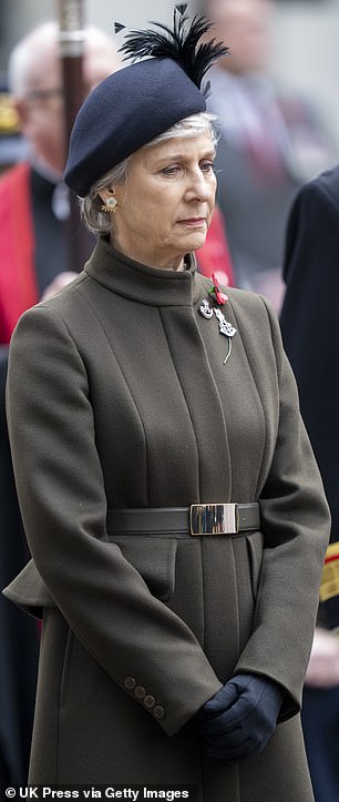 The Duchess of Gloucester opted for a dark coloured coat with navy accessories