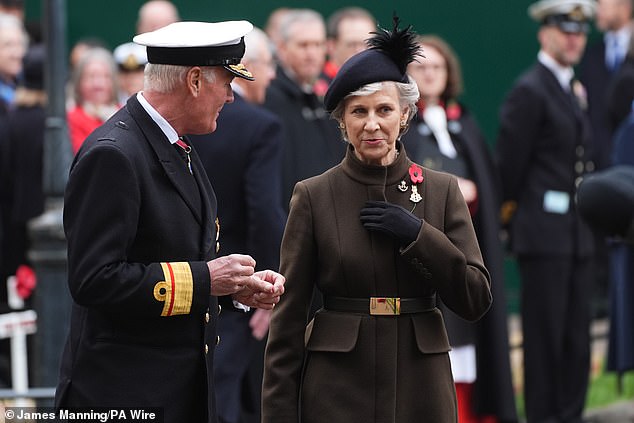 The royal is pictured with Rear Admiral Lionel Jarvis while attending the annual event at Westminster Abbey