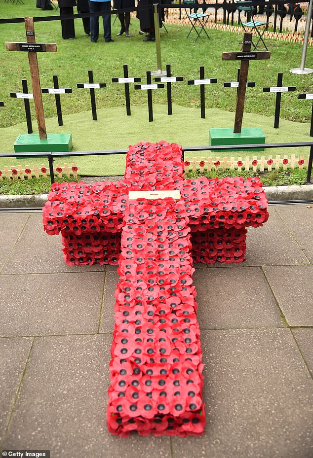 A cross made from poppies on The Field of Remembrance at Westminster Abbey today