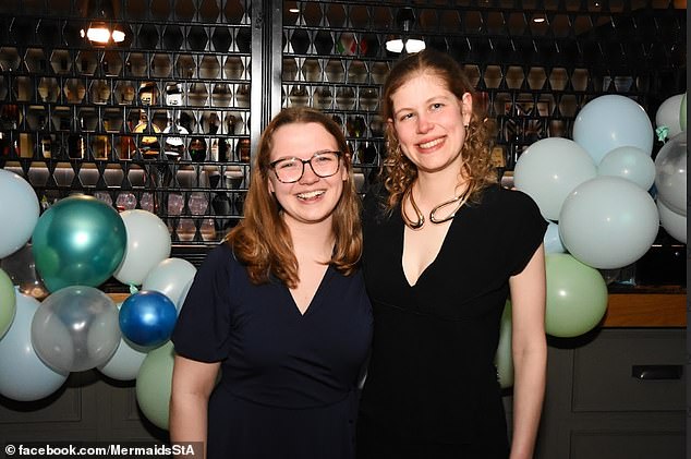 Lady Louise beams as she poses with her close pals at an event at St Andrews University