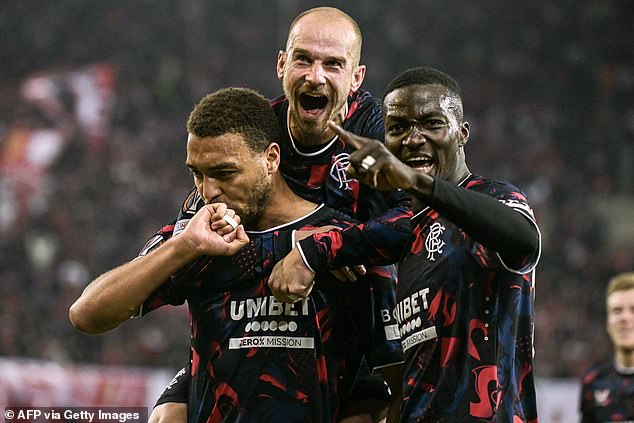 Striker Dessers, left, is congratulated by team-mates Cerny and Diomande