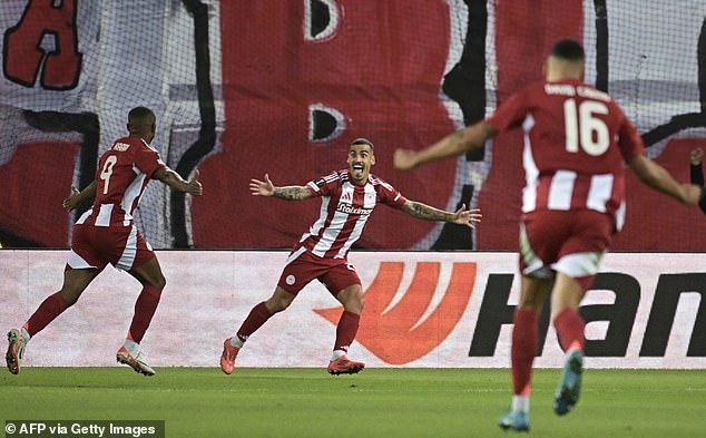 El Kaabi runs away to celebrate after scoring the opener for the Greek side