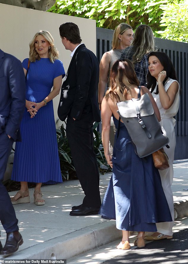 Angie Asimus (left) wore a royal blue dress that featured a pleated skirt, while new Spotlight executive producer Gemma Williams (back centre) was seen chatting with other guests