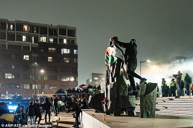 Pro-Palestinians demonstrate at Amsterdam's Anton de Komplein square ahead of the match between Ajax and Maccabi Tel Aviv