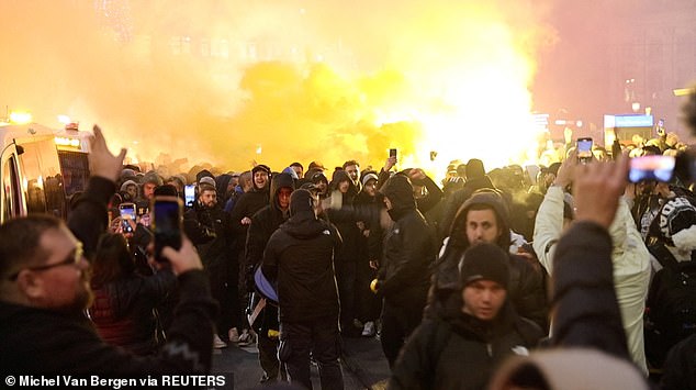 Israeli Maccabi Tel Aviv supporters demonstrate and light flares in Amsterdam